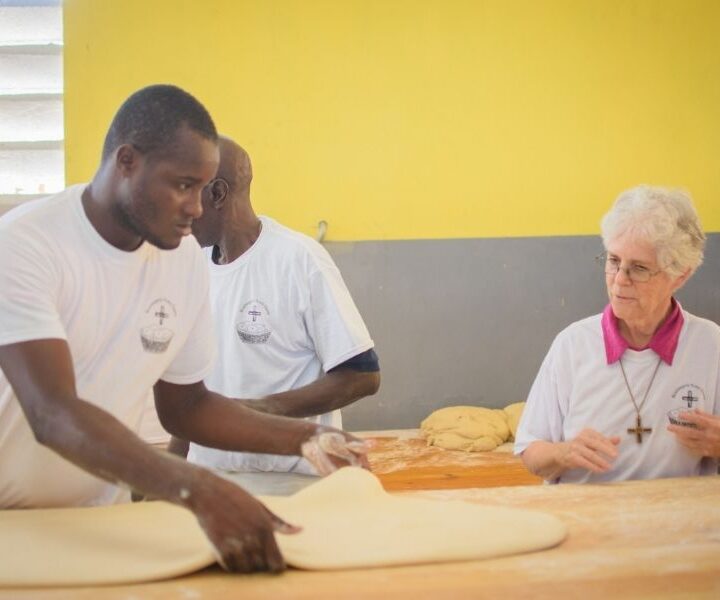 Haiti Bakery workers and Sissy Corr 900x600 1