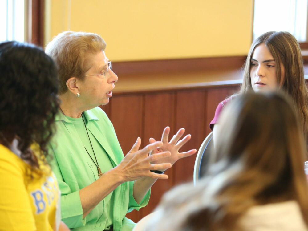 Sister Patricia O'Brien speaking to Notre Dame San Jose Students.