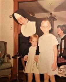 Eileen Finnigan, SNDdeN with young family members.