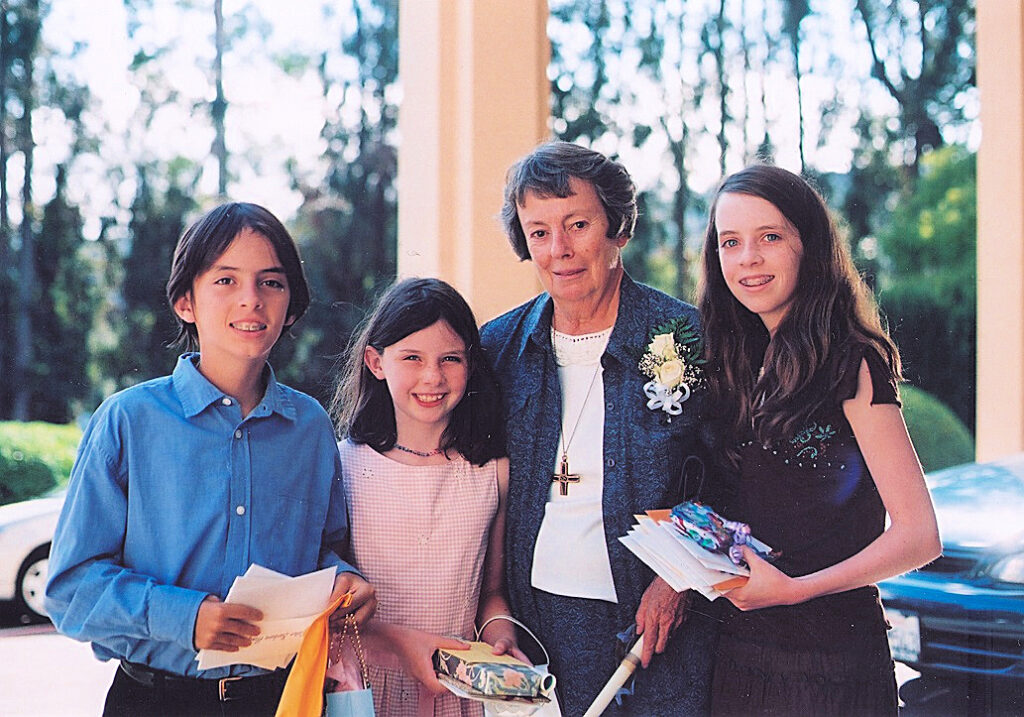 Sister Barbara Hanagan with young relatives at her 60th Jubilee celebration in 2005.