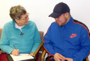 Sister Mary Ellen Howard, SNDdeN, while serving as Outreach Director for Clara's House, in Sacramento, CA.