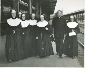 Sister Barbara Ann (far right) and other Sisters from California arrive at the Seattle train station on their way to open St. Francis School in Seahurst, Wash.