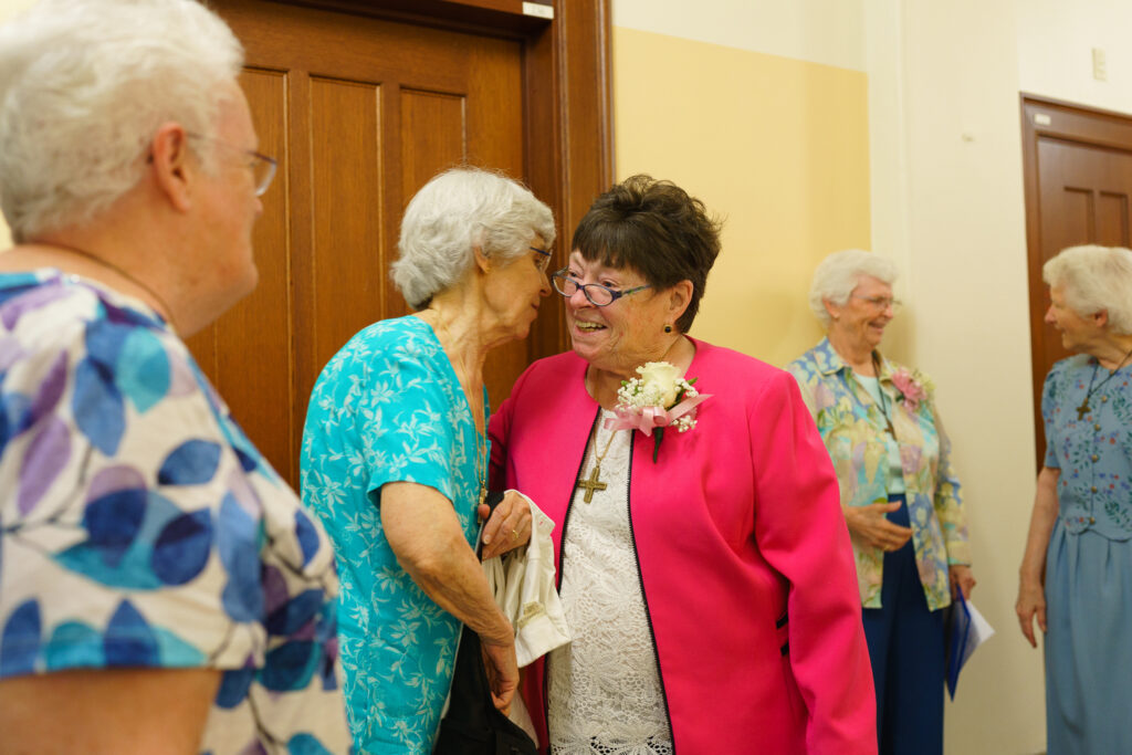 Sister Ann Daly, SNDdeN, with Sister Mary Kelleher, SNDdeN, at the 2023 Jubilee Celebration at Emmanuel College in Boston, Mass.