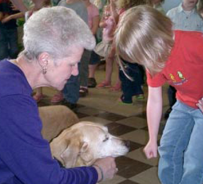 Sister Margaret Lederer teaches preschoolers how to interact with dogs. Photo courtesy of the Humane Society of Cowlitz County, Wash.
