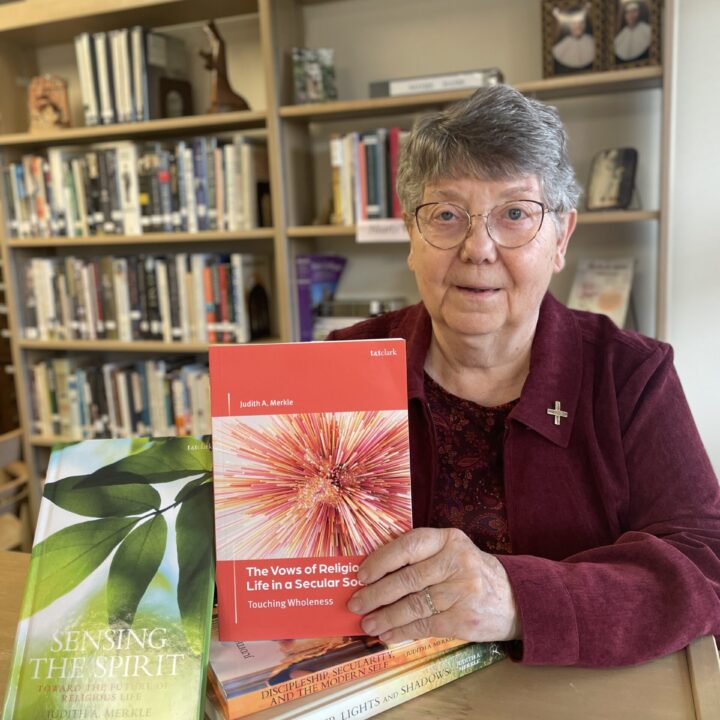 Sister Judith A. Merkle, SNDdeN of the Ohio Province holds her latest book, "The Vows of Religious Life in a Secular Society."