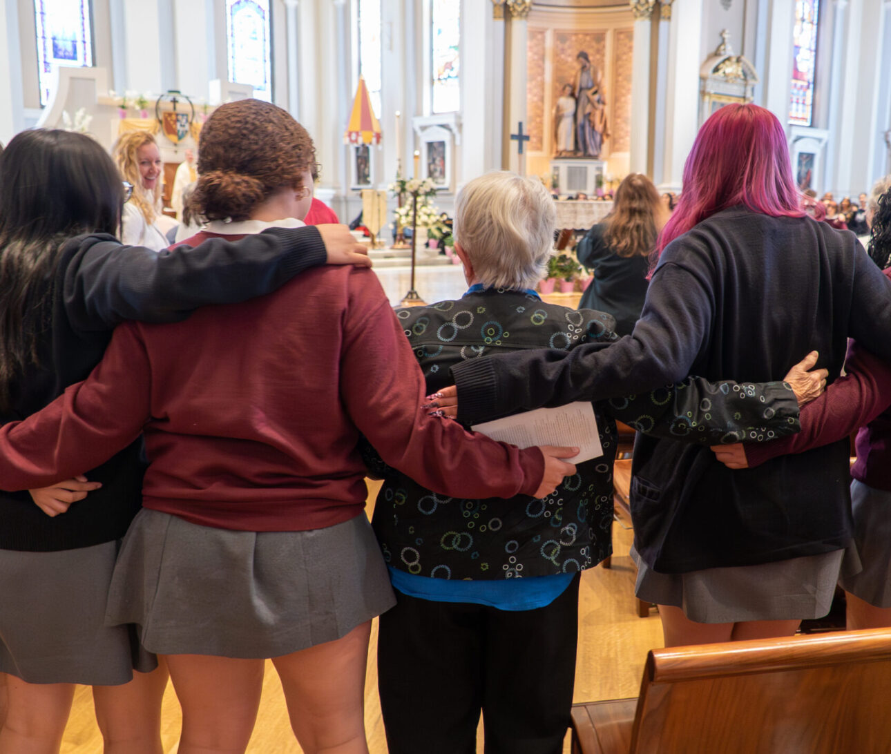 Students and Sisters join arm and arm at NDHS San Jose's liturgy celebrating 175th anniversary