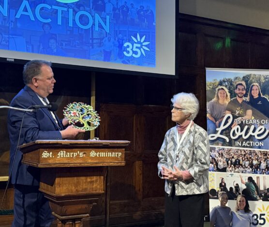 Ted Miles presents a special aware to Sister Sissy Corr at the 35th