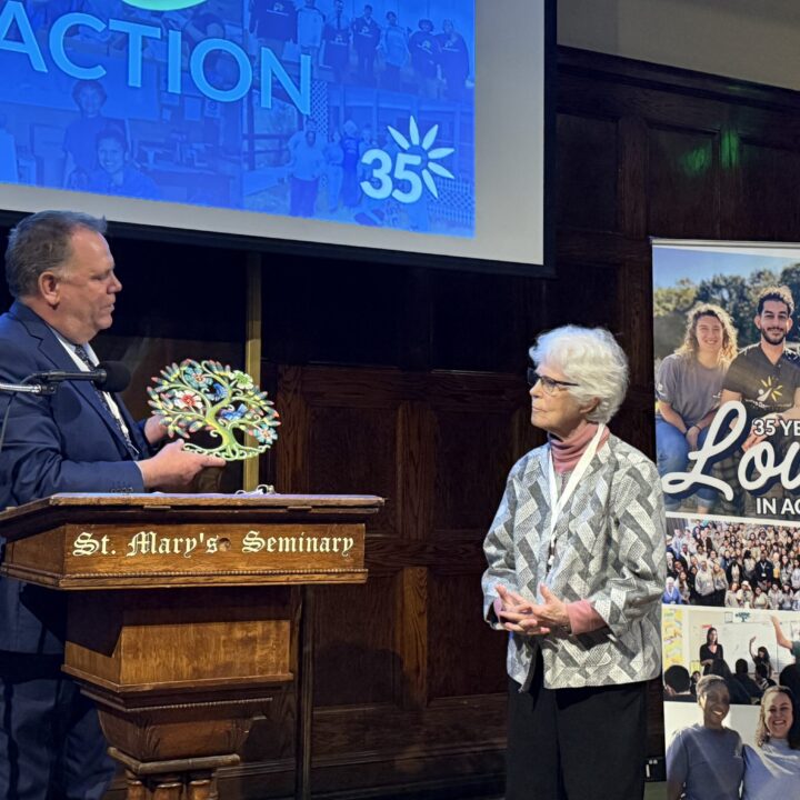 Ted Miles presents a special aware to Sister Sissy Corr at the 35th