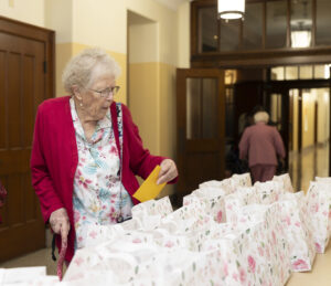 Sister checking out gift bags display Emmanuel Jubilee 2026