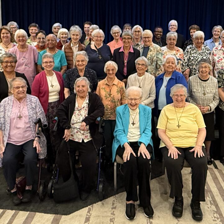 Large group of Sisters of Notre Dame de Namur standing together at California 175th Anniversary Luncheon