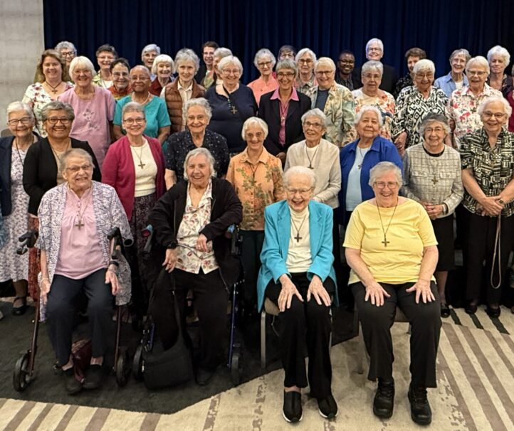 Large group of Sisters of Notre Dame de Namur standing together at California 175th Anniversary Luncheon
